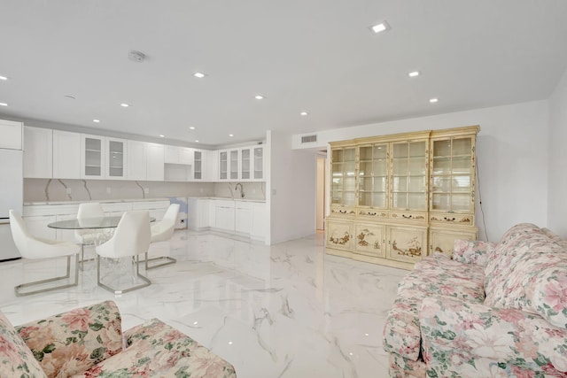 20 Somerset Unit A, West Palm Beach, FL 33417 - living area featuring light marble finish floors and recessed lighting