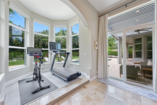 7815 Fairway Ln, West Palm Beach, FL 33412 - workout room with healthy amount of natural light and arched walkways