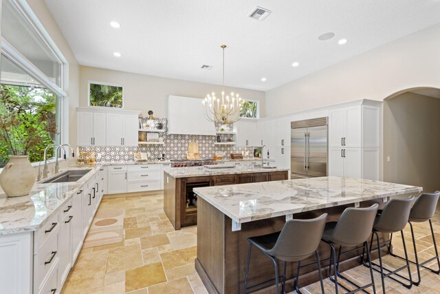 7815 Fairway Ln, West Palm Beach, FL 33412 - kitchen with appliances with stainless steel finishes, a sink, a large island, tasteful backsplash, and recessed lighting