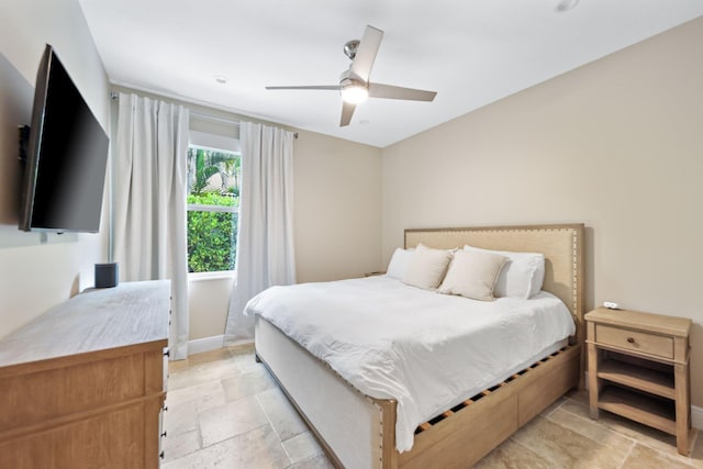 7815 Fairway Ln, West Palm Beach, FL 33412 - bedroom with stone tile flooring, baseboards, and ceiling fan
