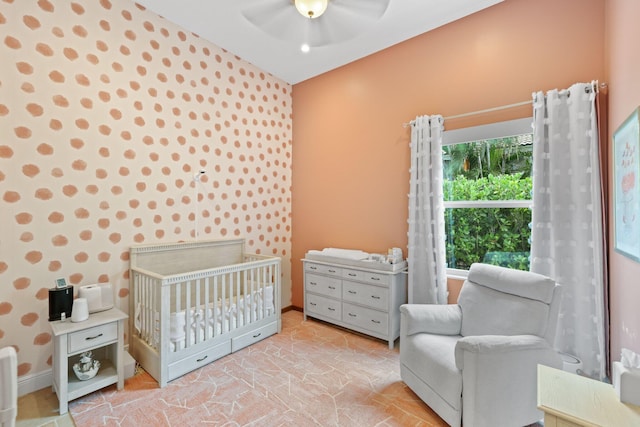 7815 Fairway Ln, West Palm Beach, FL 33412 - bedroom featuring a crib, ceiling fan, and baseboards