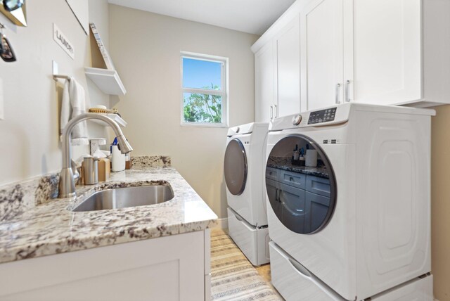 7815 Fairway Ln, West Palm Beach, FL 33412 - laundry room featuring cabinet space, washer and dryer, and baseboards