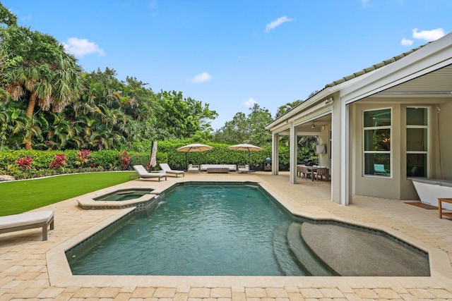 7815 Fairway Ln, West Palm Beach, FL 33412 - view of pool with a patio area, a pool with connected hot tub, and an outdoor hangout area