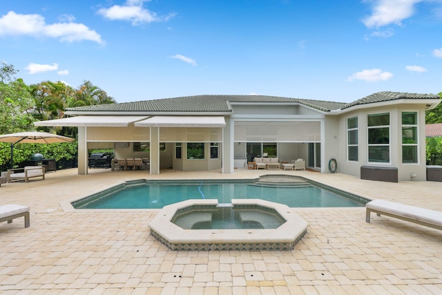 7815 Fairway Ln, West Palm Beach, FL 33412 - view of swimming pool with an outdoor living space, a patio, a pool with connected hot tub, and a grill