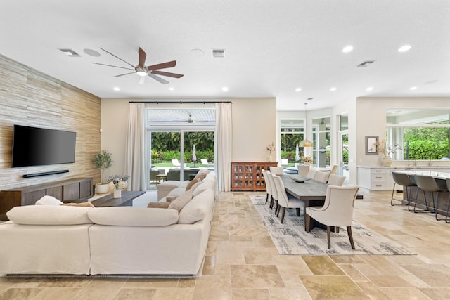 7815 Fairway Ln, West Palm Beach, FL 33412 - living room with a ceiling fan, light stone finish floors, and recessed lighting