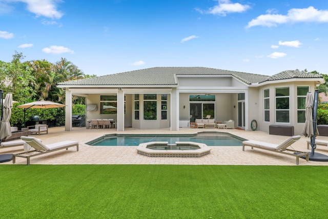 7815 Fairway Ln, West Palm Beach, FL 33412 - back of house with an outdoor living space, a patio area, a lawn, and a tiled roof