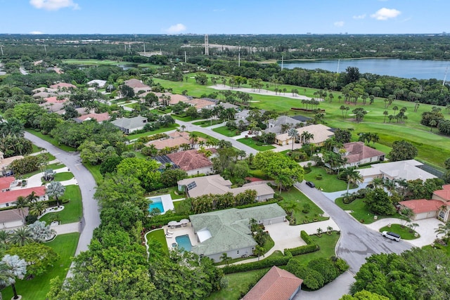 7815 Fairway Ln, West Palm Beach, FL 33412 - drone / aerial view of a large body of water, a local golf course, a pool area, and a tree filled landscape