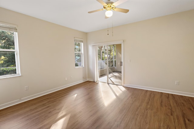 2365 55th Sq, Vero Beach, FL 32966 - unfurnished room with plenty of natural light, wood finished floors, and baseboards