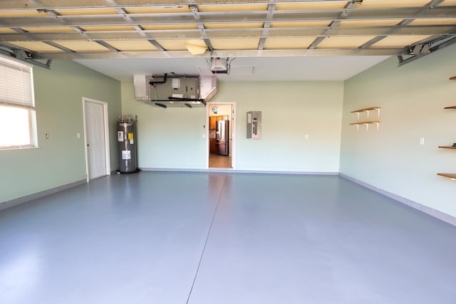 2365 55th Sq, Vero Beach, FL 32966 - garage with electric panel, electric water heater, a garage door opener, and baseboards