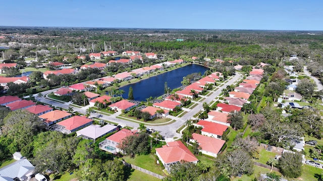 2365 55th Sq, Vero Beach, FL 32966 - aerial overview of property's location featuring nearby suburban area, a nearby body of water, and a forest