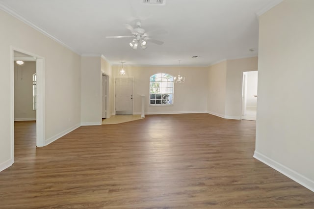 2365 55th Sq, Vero Beach, FL 32966 - spare room with a chandelier, ceiling fan, crown molding, baseboards, and wood finished floors