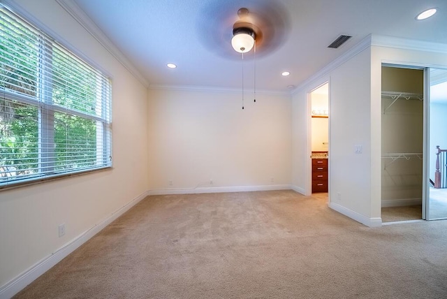 8328 Cocoplum Sound Ln, West Palm Beach, FL 33411 - unfurnished bedroom with light colored carpet, crown molding, baseboards, recessed lighting, and a closet