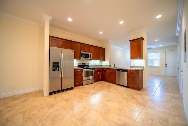 8328 Cocoplum Sound Ln, West Palm Beach, FL 33411 - kitchen with stainless steel appliances, recessed lighting, ornamental molding, light stone counters, and baseboards
