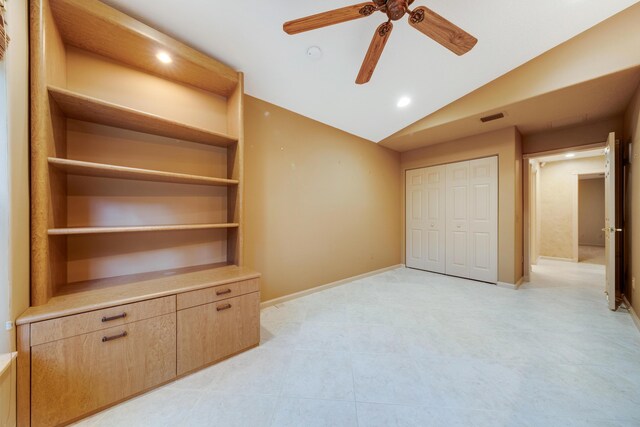 7535 Tarpon Cove Cir, Lake Worth, FL 33467 - unfurnished bedroom with vaulted ceiling, a closet, recessed lighting, baseboards, and light tile patterned floors