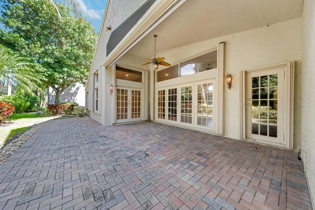 7535 Tarpon Cove Cir, Lake Worth, FL 33467 - view of patio featuring french doors and a ceiling fan