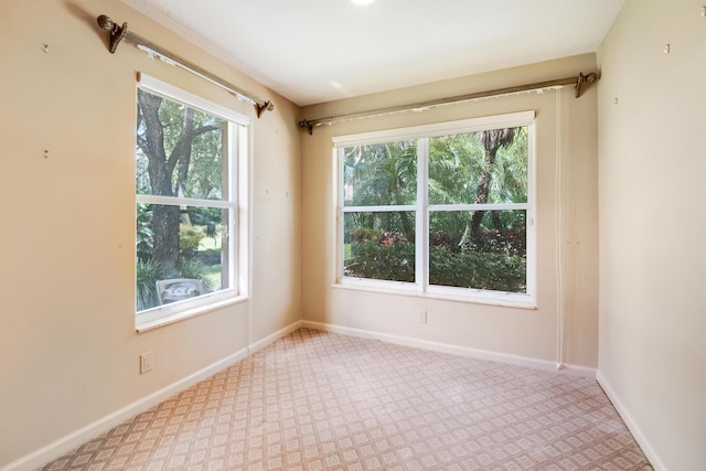 7535 Tarpon Cove Cir, Lake Worth, FL 33467 - carpeted empty room with healthy amount of natural light and baseboards