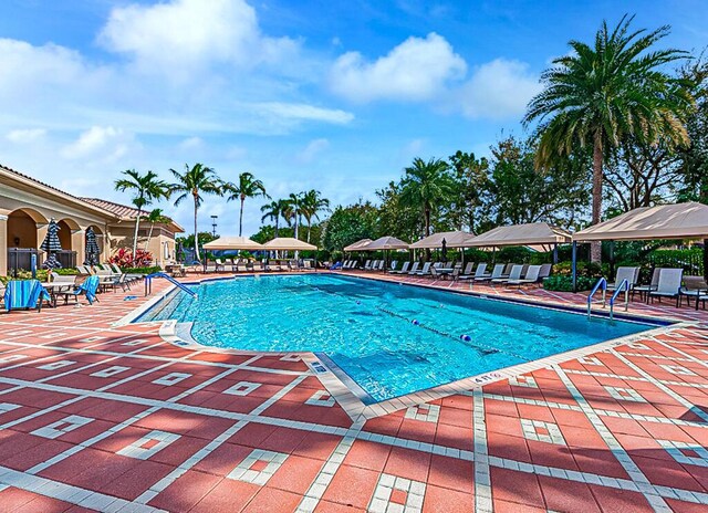 7535 Tarpon Cove Cir, Lake Worth, FL 33467 - community pool with a patio