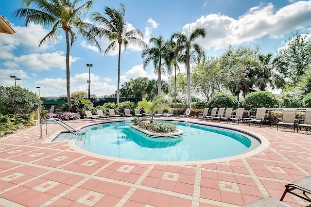 7535 Tarpon Cove Cir, Lake Worth, FL 33467 - community pool featuring a patio