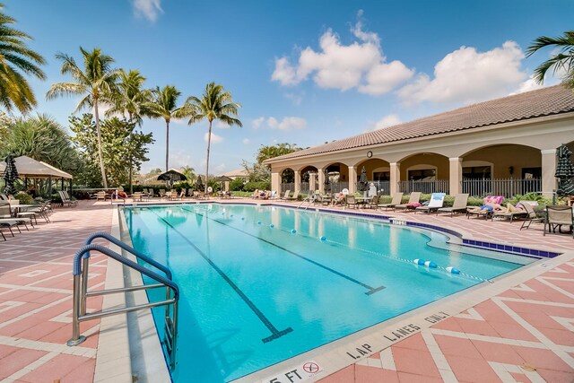7535 Tarpon Cove Cir, Lake Worth, FL 33467 - community pool with a patio and a gazebo