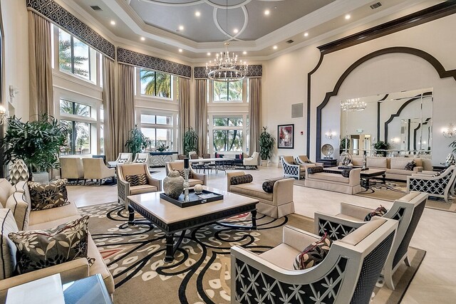 7535 Tarpon Cove Cir, Lake Worth, FL 33467 - community lobby featuring a towering ceiling, crown molding, and recessed lighting