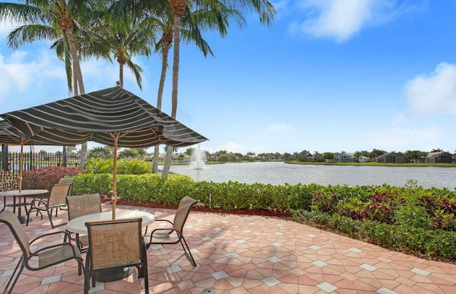 7535 Tarpon Cove Cir, Lake Worth, FL 33467 - view of patio / terrace with a water view