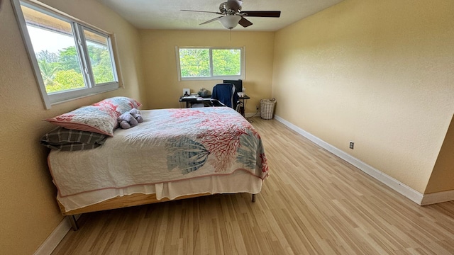 22544 Sawfish Ter, Boca Raton, FL 33428 - bedroom with baseboards, light wood finished floors, and ceiling fan