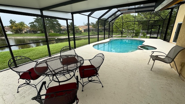22544 Sawfish Ter, Boca Raton, FL 33428 - view of pool with a patio area, a water view, a lawn, a pool with connected hot tub, and a lanai