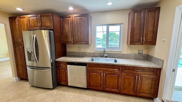 22544 Sawfish Ter, Boca Raton, FL 33428 - kitchen with stainless steel appliances, a sink, light countertops, recessed lighting, and light tile patterned floors