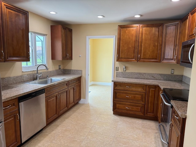 22544 Sawfish Ter, Boca Raton, FL 33428 - kitchen with stainless steel appliances, a sink, recessed lighting, and light countertops