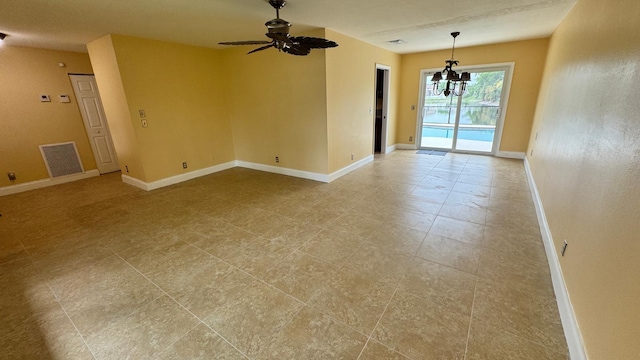 22544 Sawfish Ter, Boca Raton, FL 33428 - empty room featuring a chandelier, baseboards, and a ceiling fan