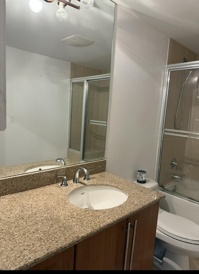 610 Clematis St Unit 336, West Palm Beach, FL 33401 - full bathroom with vanity, toilet, and enclosed tub / shower combo