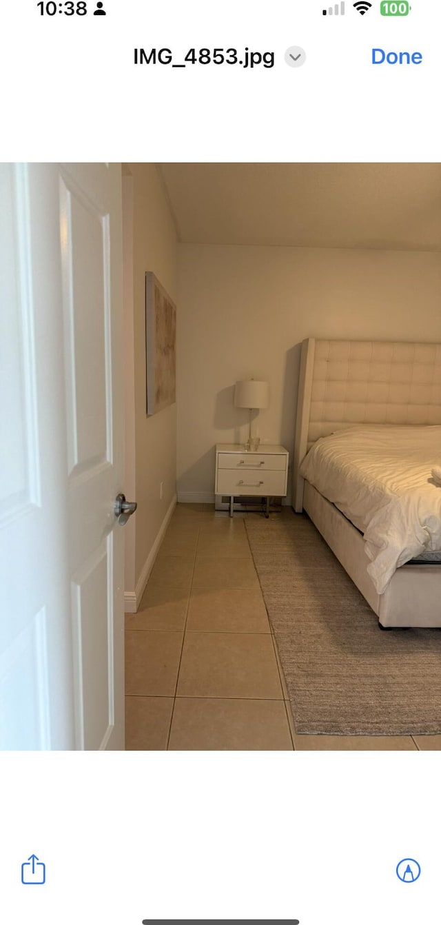 610 Clematis St Unit 336, West Palm Beach, FL 33401 - bedroom featuring light tile patterned flooring and baseboards