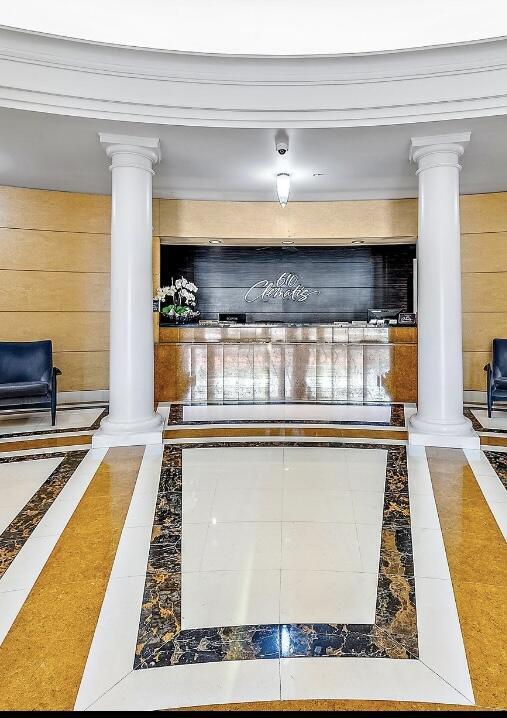 610 Clematis St Unit 336, West Palm Beach, FL 33401 - reception area featuring ornate columns and a surveillance system