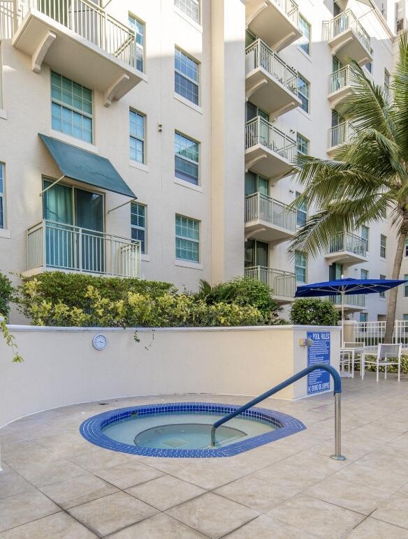 610 Clematis St Unit 336, West Palm Beach, FL 33401 - view of swimming pool featuring a community hot tub