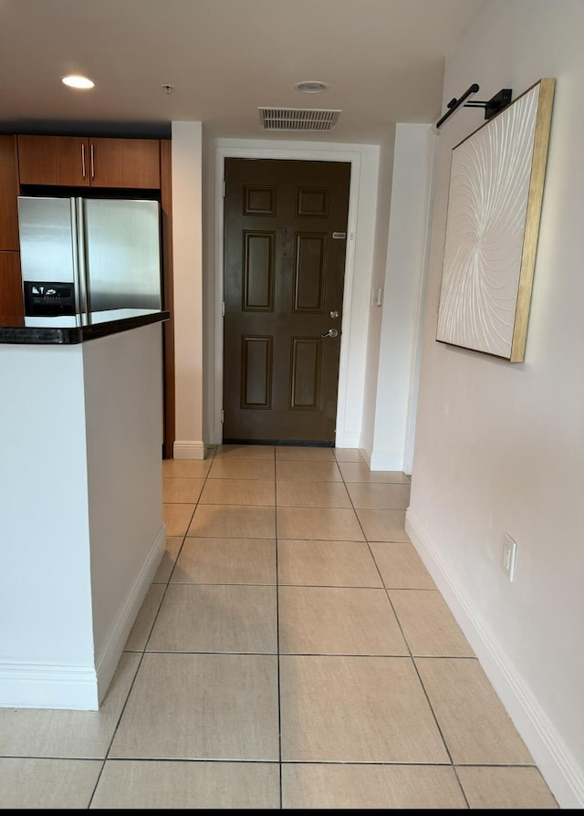 610 Clematis St Unit 336, West Palm Beach, FL 33401 - hall with light tile patterned floors and baseboards