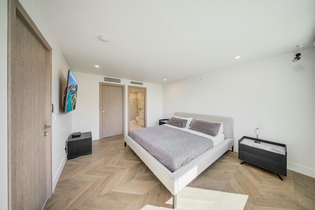 901 E Camino Real Unit 2A, Boca Raton, FL 33432 - bedroom featuring baseboards, recessed lighting, and ensuite bath