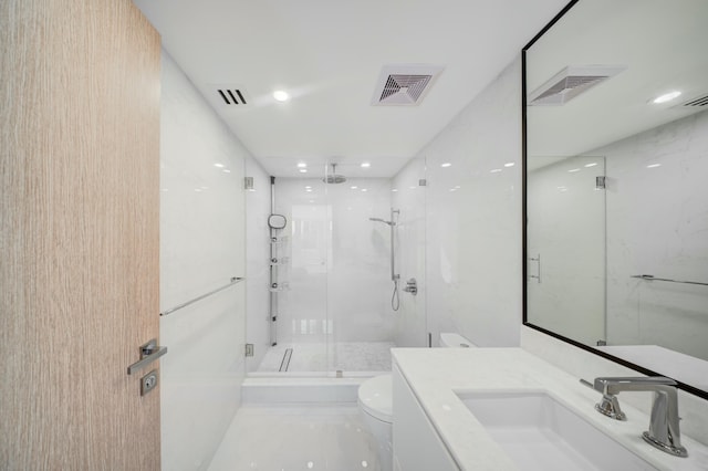 901 E Camino Real Unit 2A, Boca Raton, FL 33432 - bathroom with a marble finish shower, toilet, vanity, and recessed lighting