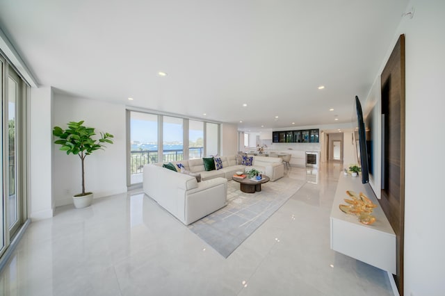 901 E Camino Real Unit 2A, Boca Raton, FL 33432 - living room with recessed lighting and light tile patterned floors