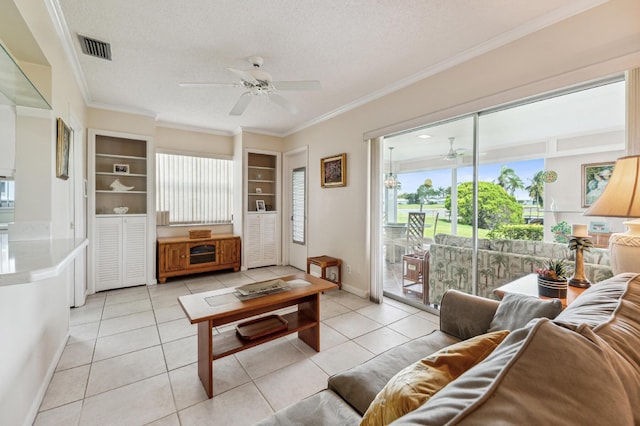 1803 SW 5th Ave, Boynton Beach, FL 33426 - living area with ceiling fan, ornamental molding, light tile patterned flooring, a textured ceiling, and baseboards