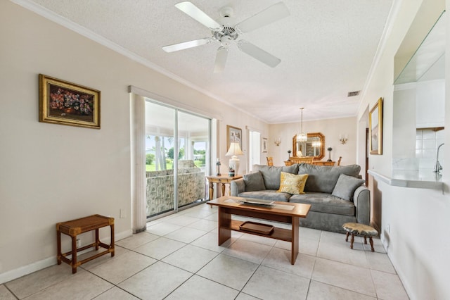1803 SW 5th Ave, Boynton Beach, FL 33426 - living area with a textured ceiling, ornamental molding, light tile patterned flooring, ceiling fan, and baseboards
