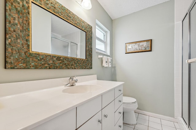 1803 SW 5th Ave, Boynton Beach, FL 33426 - bathroom featuring toilet, vanity, a stall shower, tile patterned flooring, and a textured ceiling