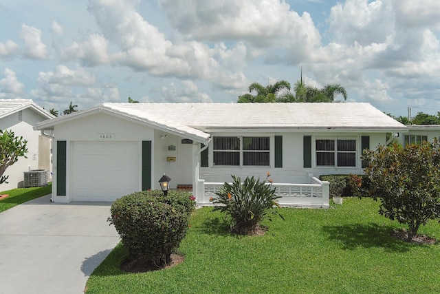 1803 SW 5th Ave, Boynton Beach, FL 33426 - single story home featuring concrete driveway, a front yard, an attached garage, central AC, and stucco siding