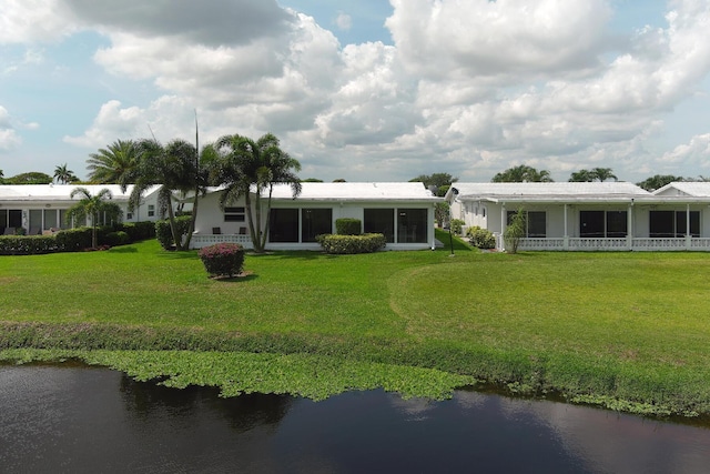 1803 SW 5th Ave, Boynton Beach, FL 33426 - rear view of property featuring a yard and a water view