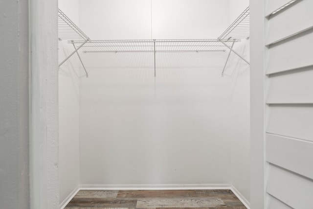 2307 SE Seafury Ln SE, Port Saint Lucie, FL 34952 - walk in closet featuring dark wood finished floors