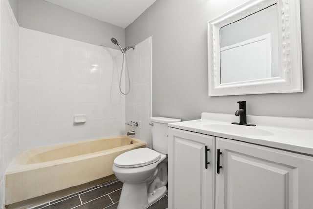 2307 SE Seafury Ln SE, Port Saint Lucie, FL 34952 - bathroom featuring toilet, vanity, and shower / washtub combination