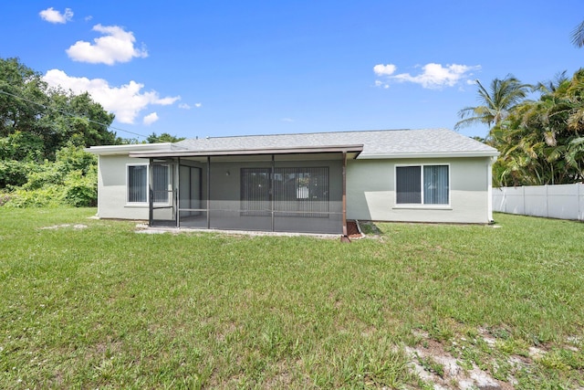 2307 SE Seafury Ln SE, Port Saint Lucie, FL 34952 - back of house with a sunroom and stucco siding