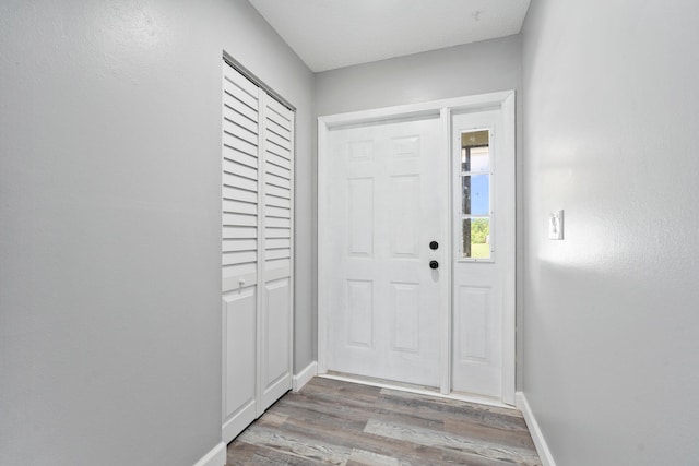 2307 SE Seafury Ln SE, Port Saint Lucie, FL 34952 - entrance foyer featuring wood finished floors and baseboards
