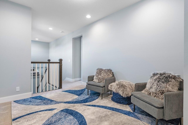 983 Hookline Cir, The Acreage, FL 33470 - living area with an upstairs landing, carpet floors, recessed lighting, and baseboards