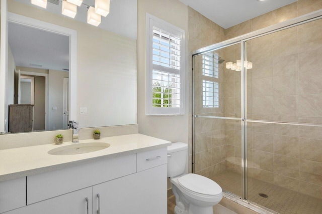 983 Hookline Cir, The Acreage, FL 33470 - bathroom with toilet, vanity, and a shower stall