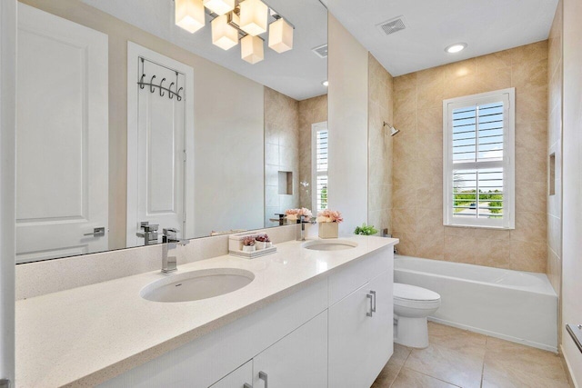 983 Hookline Cir, The Acreage, FL 33470 - full bathroom with double vanity, toilet, shower / tub combination, and tile patterned floors